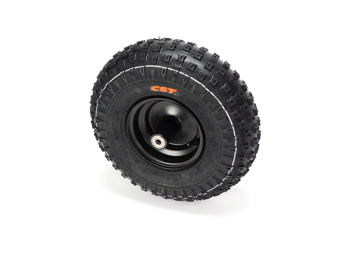 Front view of a Stomp Ebox Dragster front wheel with mounted tire, showing tread pattern and black alloy rim.
