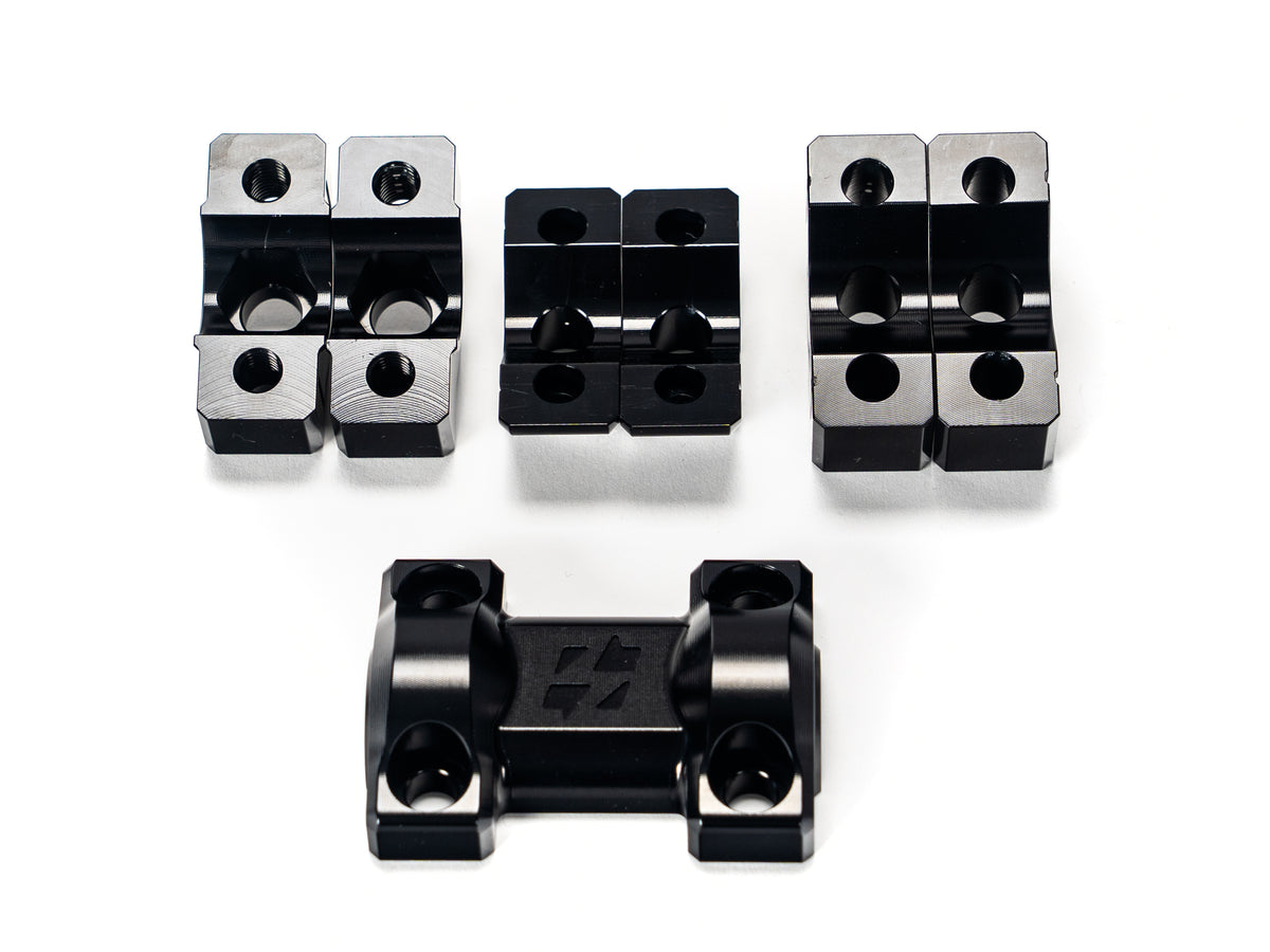Stomp Ebox Dragster RS Suspension Upgrade Kit components displayed on a white background, including shock absorbers, mounting hardware, and springs.