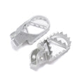 Stomp Ebox Dragster stainless steel foot pegs, angled view showing textured surface and mounting bracket.