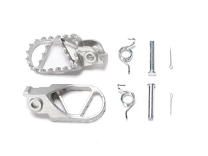 Stomp Ebox Dragster stainless steel foot pegs displayed on a white background, showing their textured surface and mounting brackets.