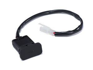 Close-up view of the Stomp Ebox Dragster USB charger port, showing the charging socket and protective cover on the electric bike frame.