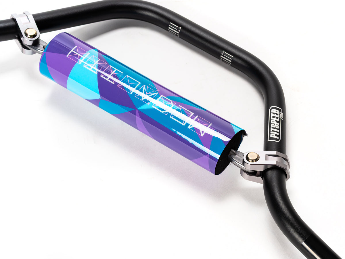 Stomp Ebox Megalith handlebar in purple and blue, close-up view showing grip texture and color gradient.