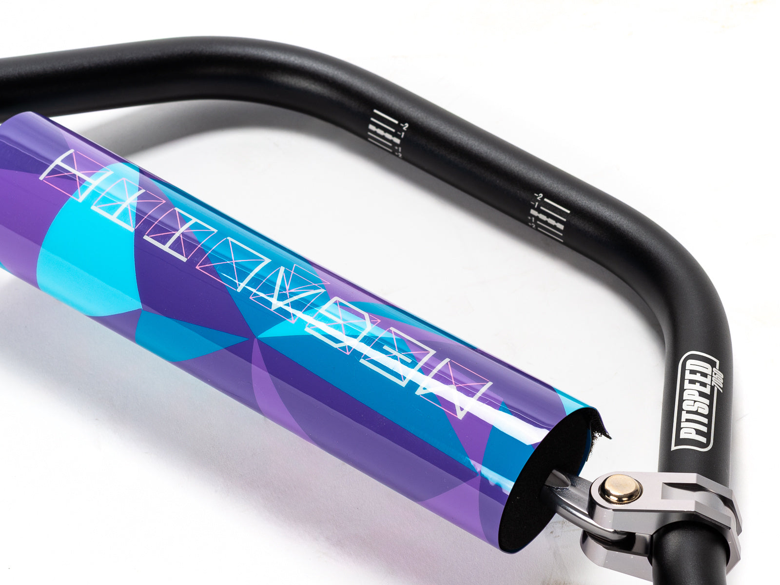 Stomp Ebox Megalith handlebar in purple and blue, close-up side view showing grip texture and color gradient.