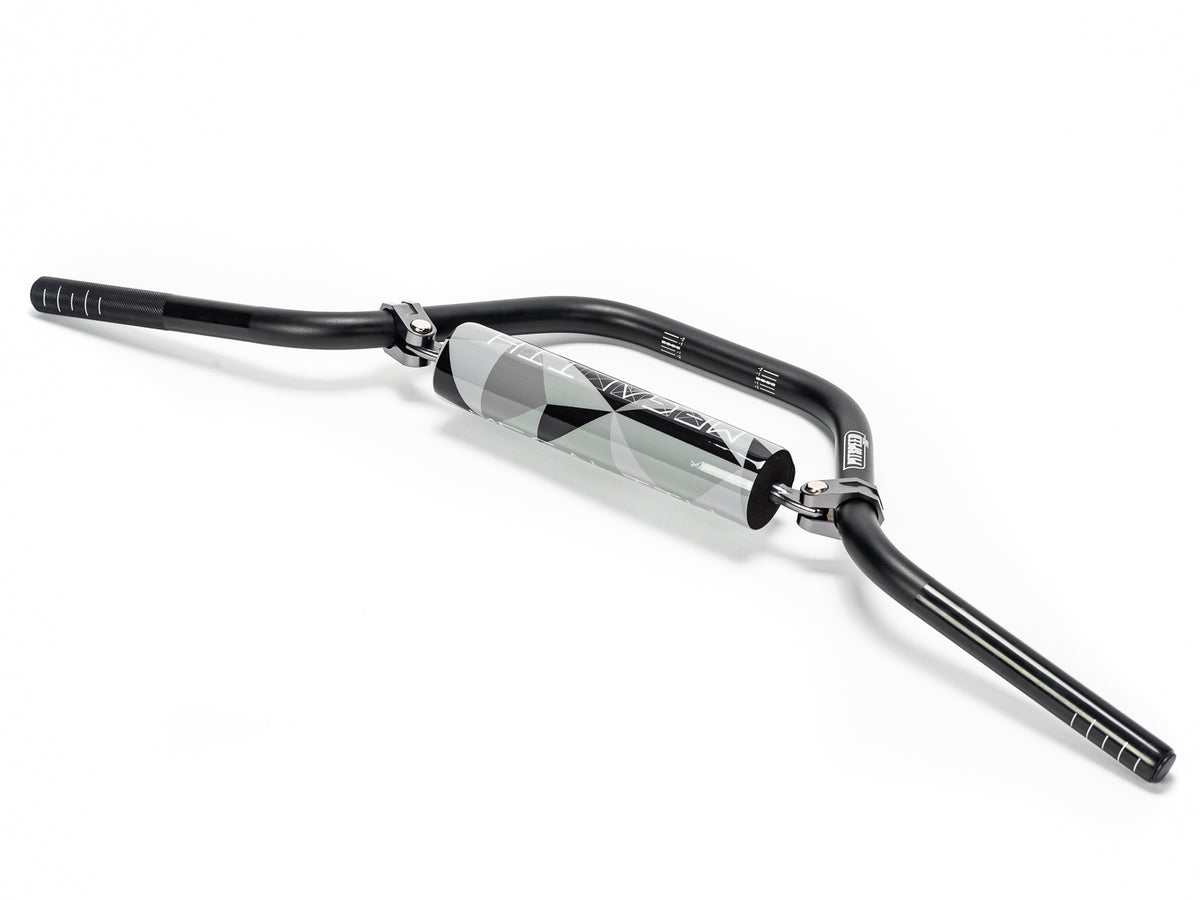 Stomp Ebox Megalith Pitspeed 7075 handlebar, close-up view showing black anodized finish and ergonomic design