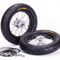 Stomp Ebox Supermoto Wheel Set 12-12, black alloy wheels with silver spokes, displayed side by side on a white background.