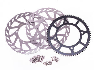 Stomp Ebox Supermoto Wheel Set 12-12, close-up view showing black alloy rims with silver spokes and knobby tires, displayed against a white background.