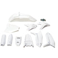 White plastic kit components for Stomp Ebox, including fenders, side panels, and number plate, displayed on a plain background.