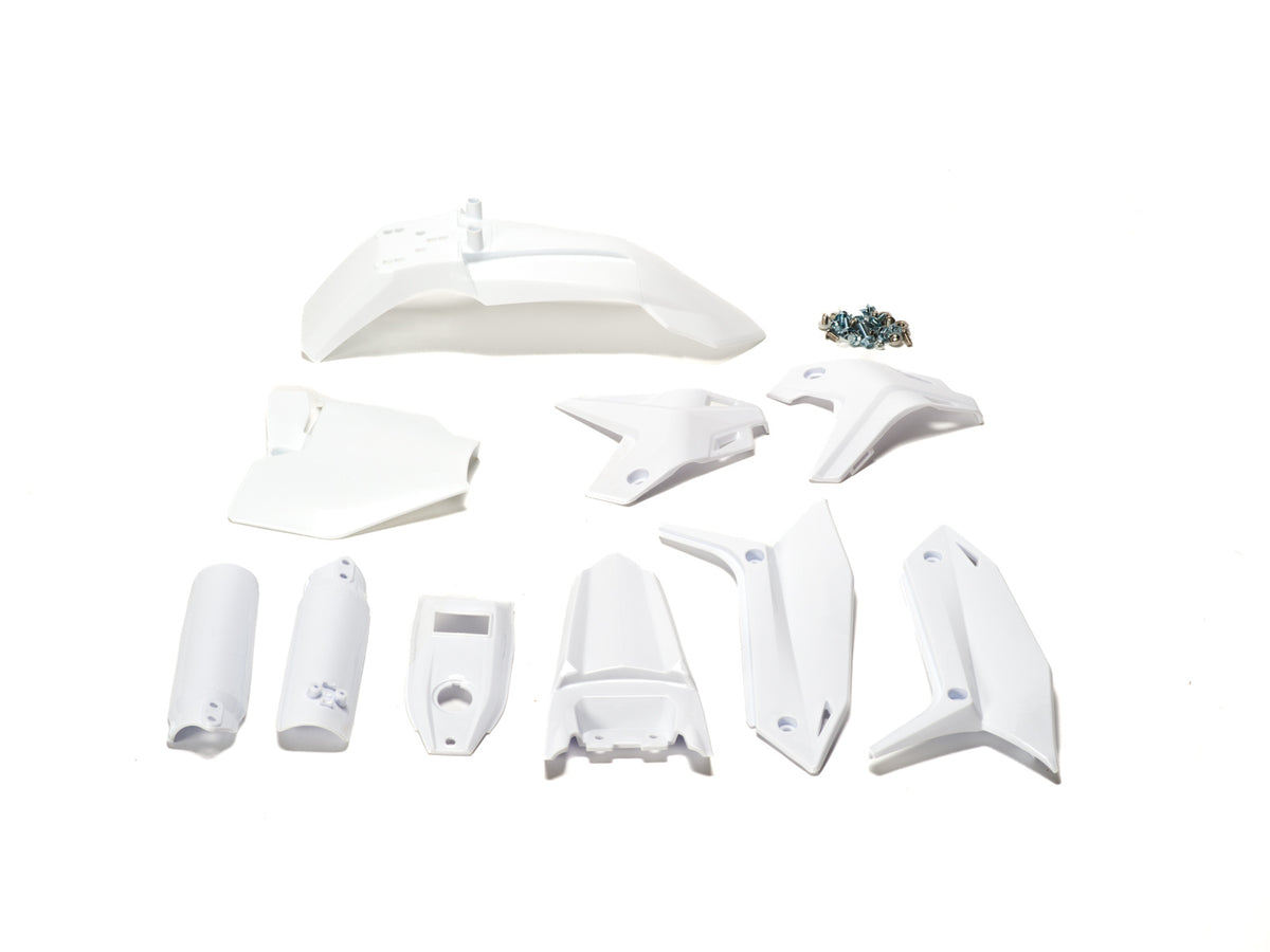 White plastic kit components for Stomp Ebox, including fenders, side panels, and number plate, displayed on a plain background.