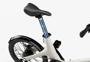 Side view of the Urtopia Carbon Fold Step Thru eBike in a folded position, showcasing its compact design and lightweight carbon fiber frame.
