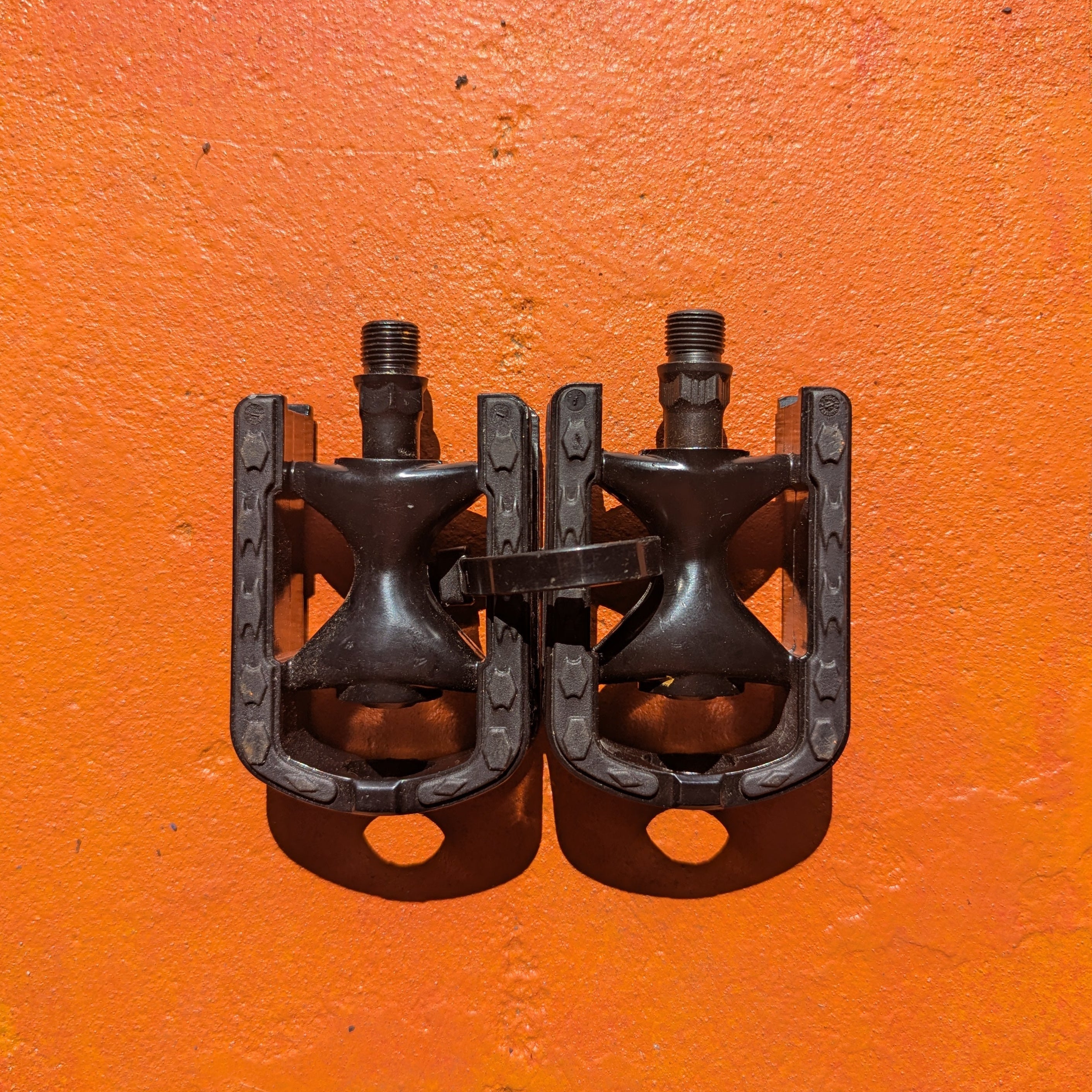 Metal bicycle pedal, style 6, featuring a durable, textured surface and sleek design, photographed on a plain background.