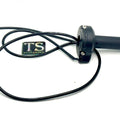 Surron LBX OEM throttle replacement shown in close-up, featuring black handle grip and attached wiring.