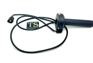 Surron LBX OEM throttle replacement shown in close-up, featuring black handle grip and attached wiring.