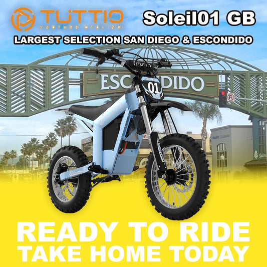 Electric motorcycle parked outdoors in sunlight, featuring a modern design with a matte finish and visible branding.