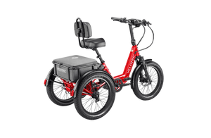 A Velotric Triker eTrike in a side view, showcasing its three-wheel design, step-through frame, rear cargo basket, and upright handlebars, set against a plain background.