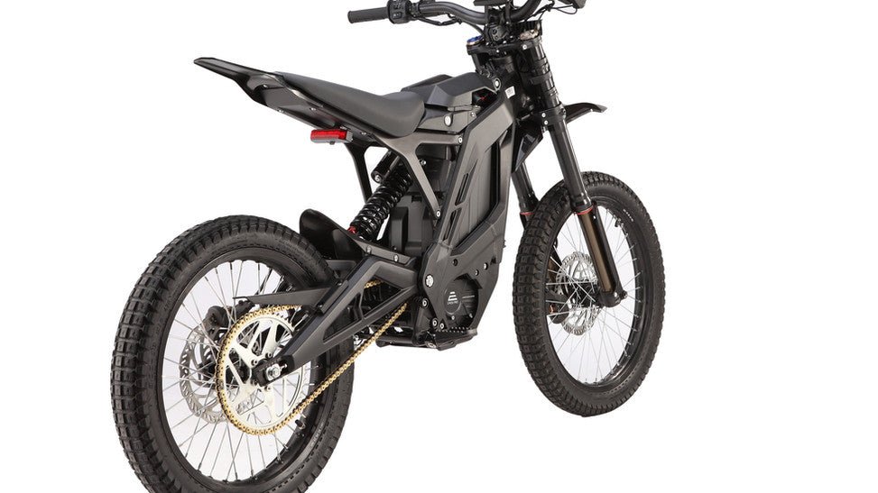 Side view of the eMOTO eRide Pro SS 3.0 Electric Dirt Bike in black and blue, showcasing its 72v 6000W motor, rugged tires, and modern frame design.