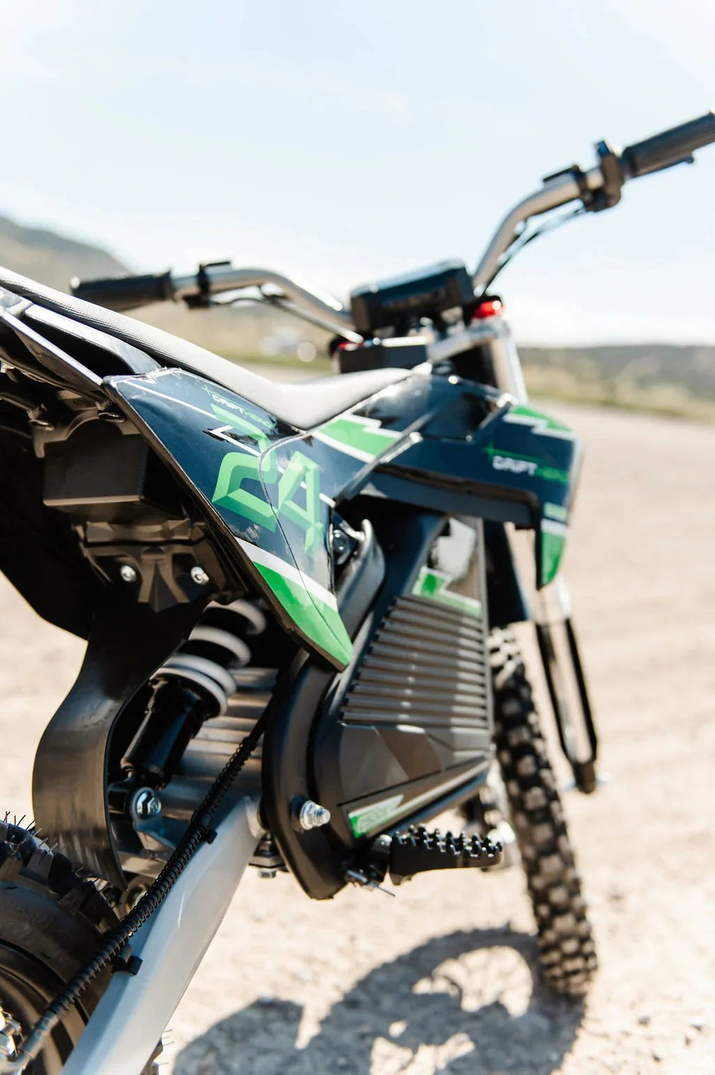 A black eMOTO eBike Drift Hero 2500w dirt bike with rugged tires, sturdy frame, and front suspension, displayed on a white background.