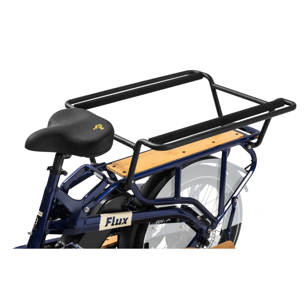 A sleek eBike Revi Flux ST in a studio setting, showcasing its modern frame design, integrated battery, and upright handlebars.