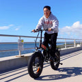 Side view of the FREEGO eFlex Raptor E1 electric folding fat tire eBike in step-over design, featuring a sturdy black frame, thick tires, and a 750W motor.